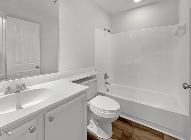 a bathroom with a sink a toilet and a bathtub