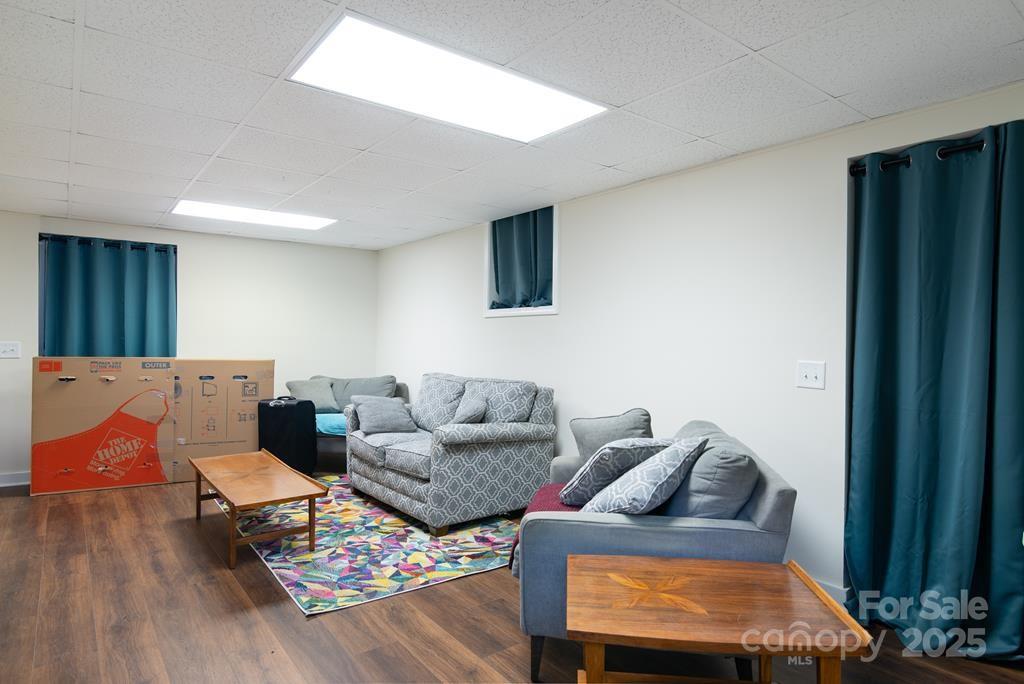 47 Hummingbird Road Franklin, NC 28734 - Photo 12 of 16 a living room with furniture and a flat screen tv
