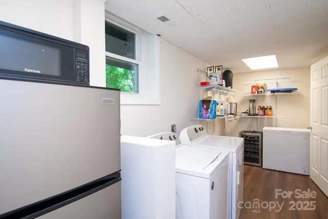 a utility room with sink washer and dryer