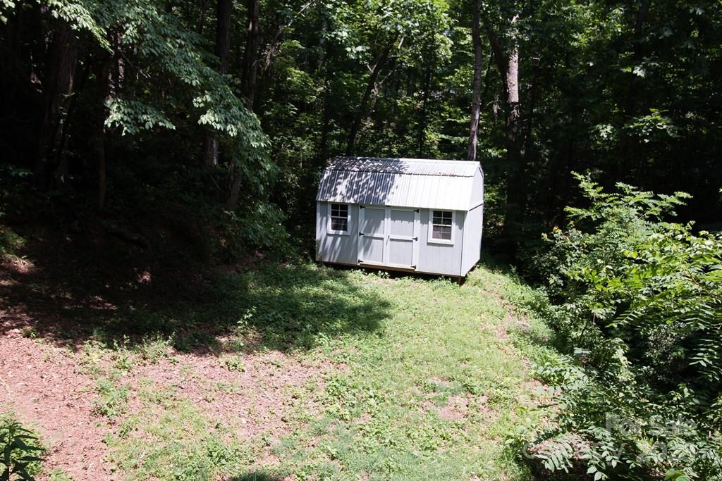 47 Hummingbird Road Franklin, NC 28734 - Photo 15 of 16 a view of a tree with a yard
