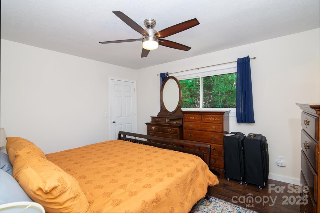 47 Hummingbird Road Franklin, NC 28734 - Photo 5 of 16 a bedroom with a bed and a flat screen tv