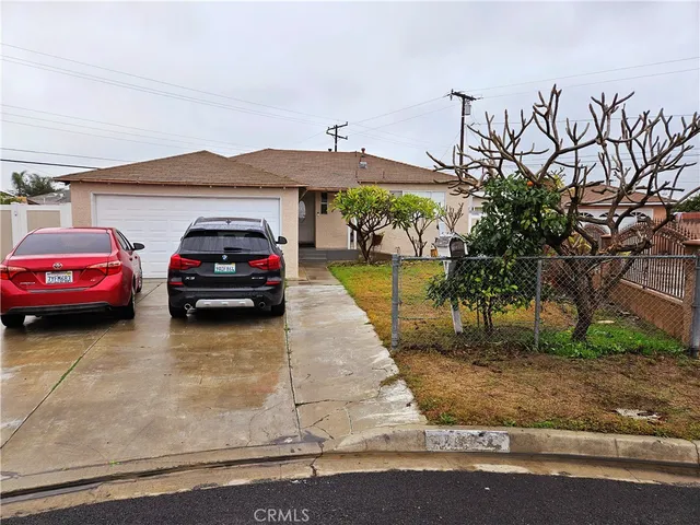 a view of a car parked in front of a house