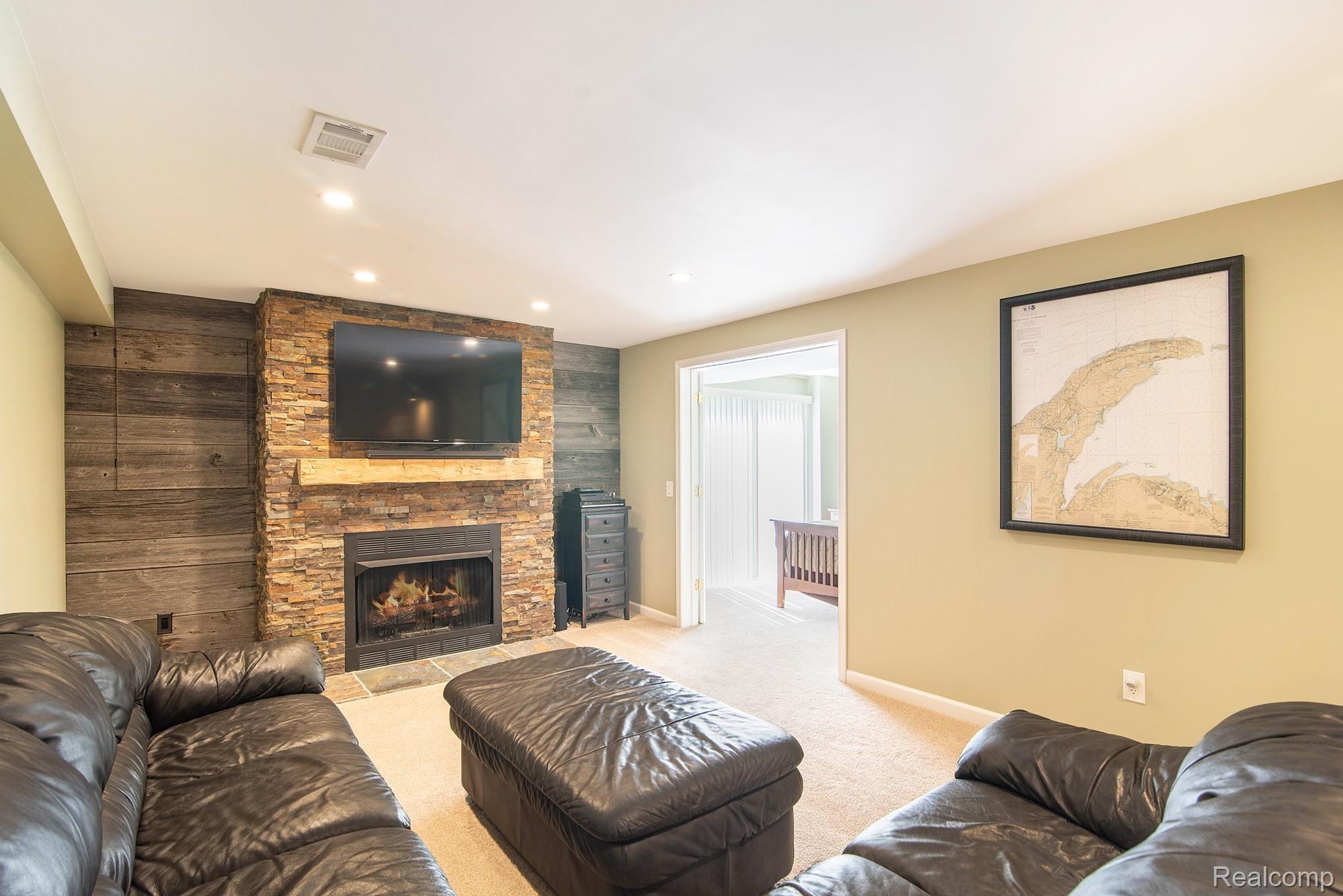 360 East Davisburg Road Holly, MI 48442 - Photo 19 of 30 Lower Level Family room with stone fireplace