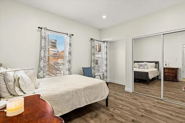 a bedroom with a bed and a view of bedroom