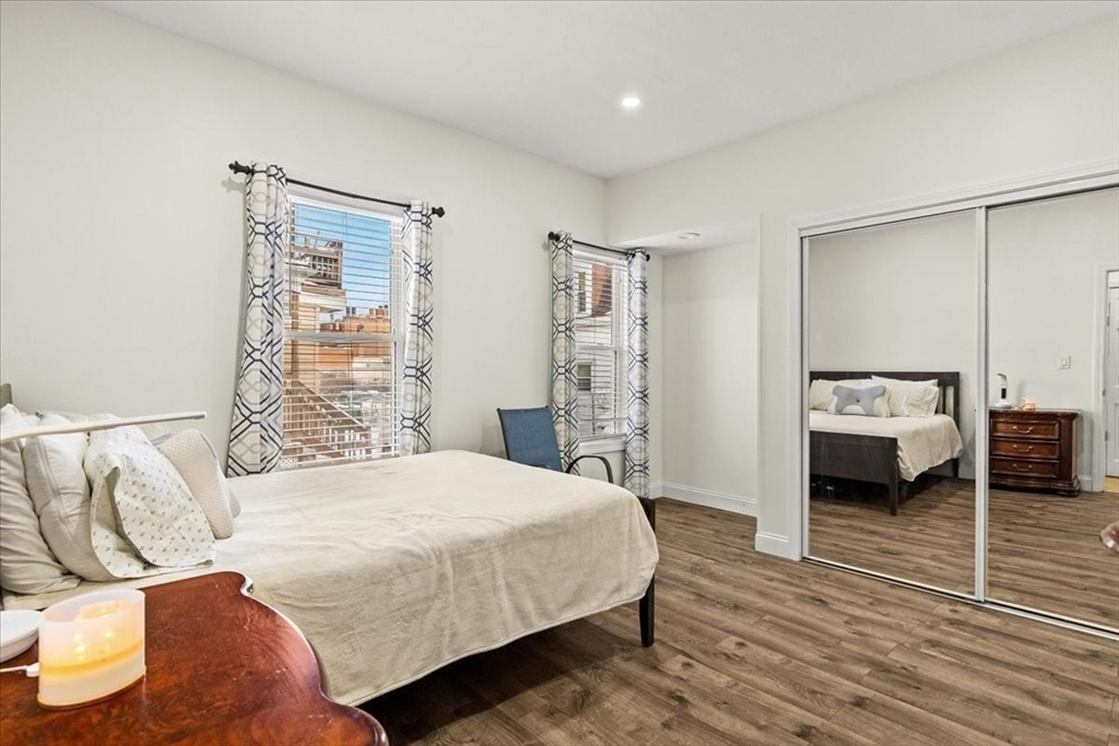 6 Arion Street Boston, MA 02125 - Photo 11 of 42 a bedroom with a bed and a view of bedroom