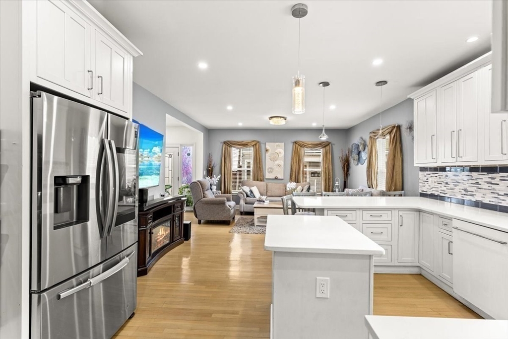 6 Arion Street Boston, MA 02125 - Photo 13 of 42 a kitchen with refrigerator and cabinets