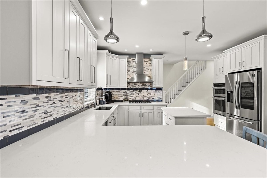 6 Arion Street Boston, MA 02125 - Photo 16 of 42 a kitchen with granite countertop a sink stainless steel appliances and counter space