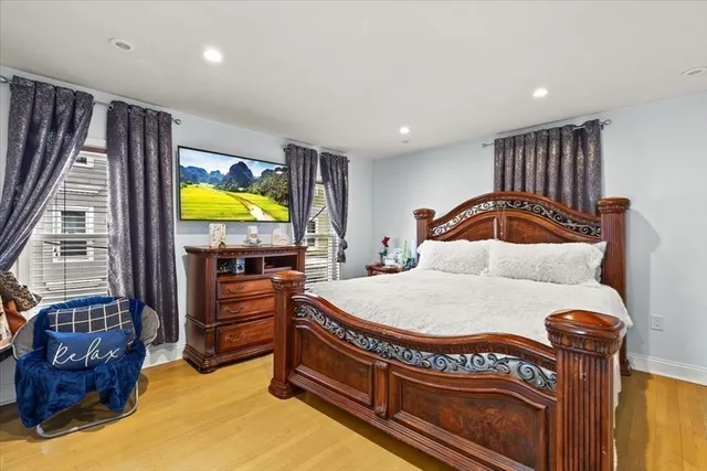 a bedroom with bed and a window