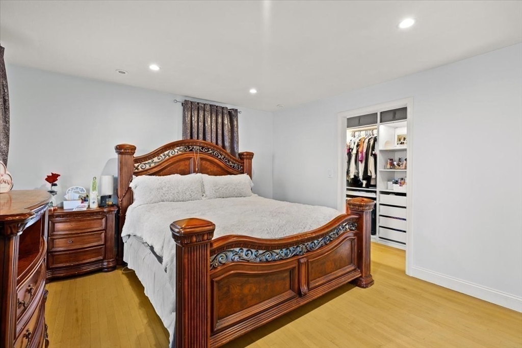 6 Arion Street Boston, MA 02125 - Photo 18 of 42 a bedroom with furniture and a rug