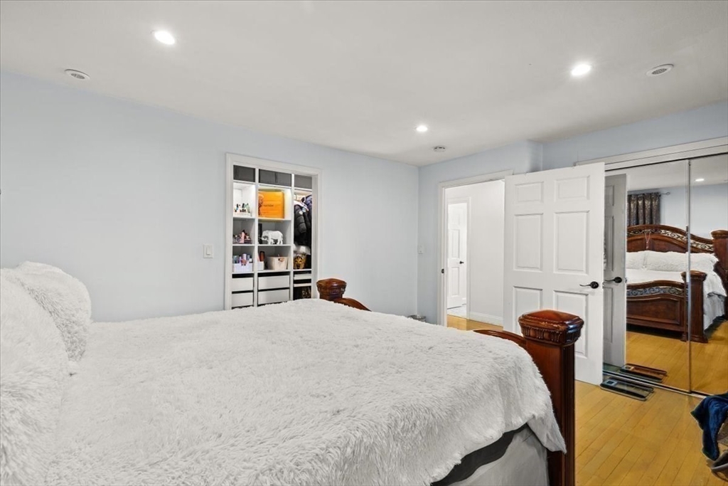 6 Arion Street Boston, MA 02125 - Photo 19 of 42 a bedroom with a bed and a large window