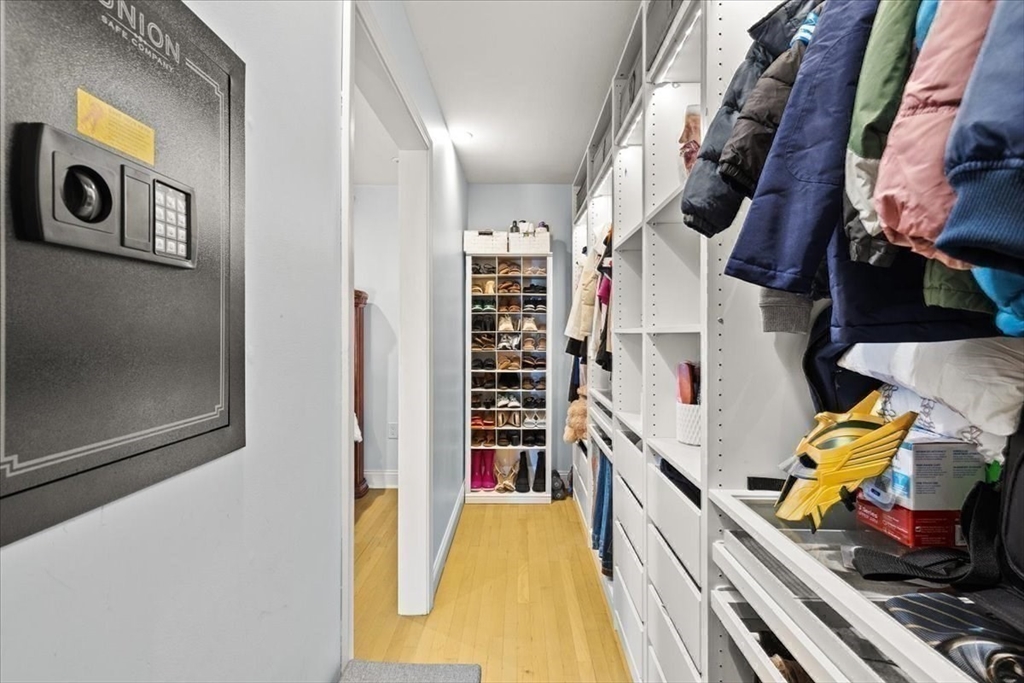 6 Arion Street Boston, MA 02125 - Photo 20 of 42 a view of walk in closet with clothes and shoes