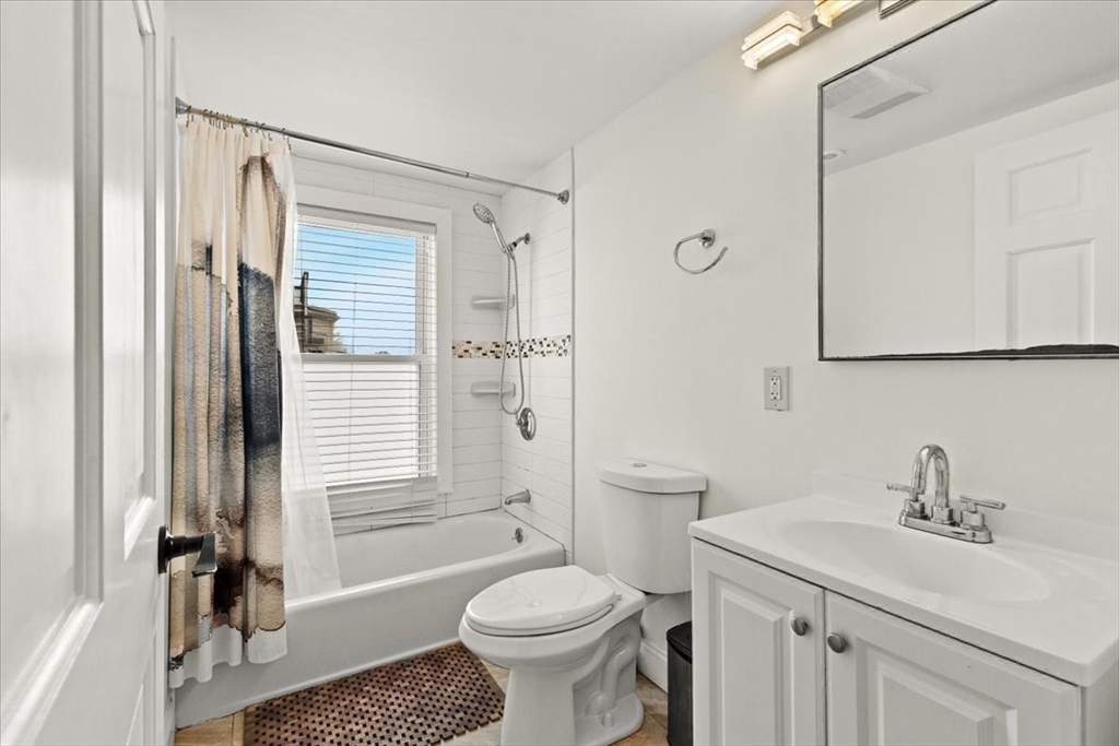 6 Arion Street Boston, MA 02125 - Photo 21 of 42 a bathroom with a sink toilet and shower