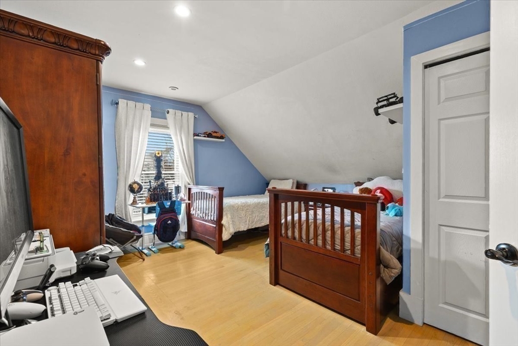 6 Arion Street Boston, MA 02125 - Photo 25 of 42 a bedroom with furniture and a window