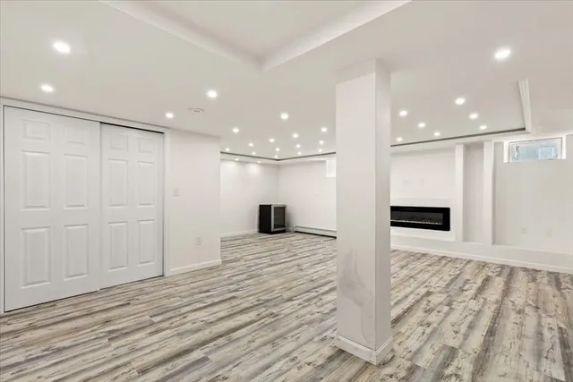 a view of a hallway with a kitchen