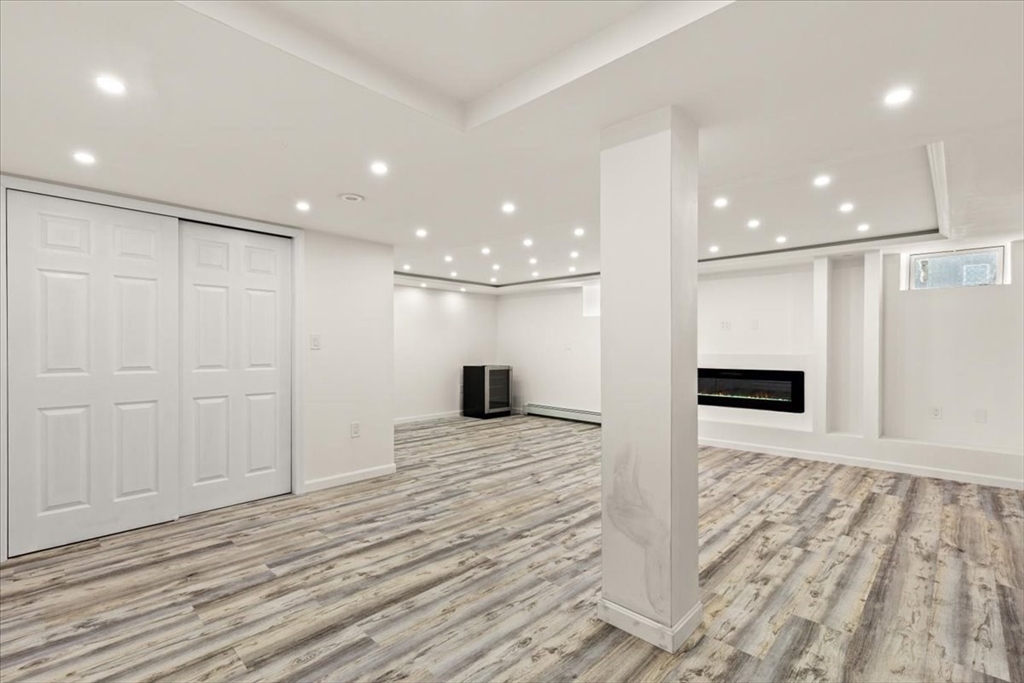 6 Arion Street Boston, MA 02125 - Photo 29 of 42 a view of a hallway with a kitchen