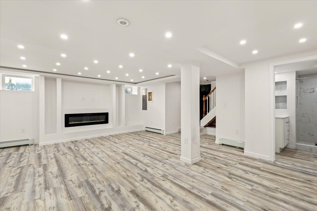 6 Arion Street Boston, MA 02125 - Photo 30 of 42 a view of empty room with wooden floor