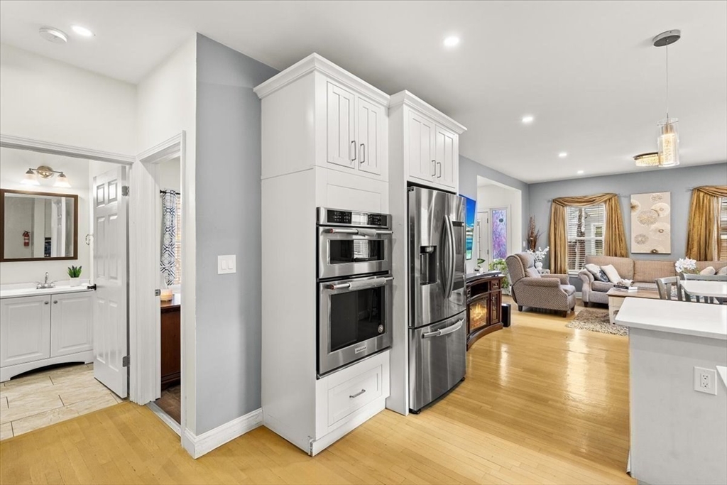 6 Arion Street Boston, MA 02125 - Photo 9 of 42 a living room with furniture and a fireplace