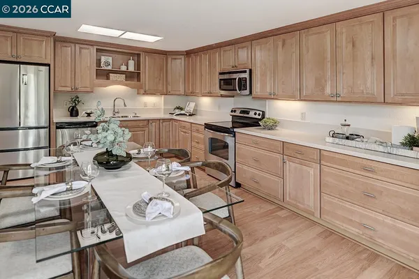 a kitchen with a sink appliances and cabinets