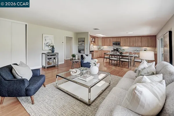 a living room with furniture and a table