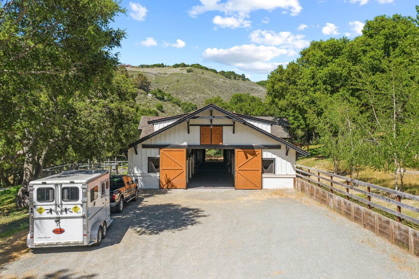 11627 Hidden Hills Road Carmel Valley, CA 93924 - Photo 11 of 62 a view of a house with a big yard and large tree