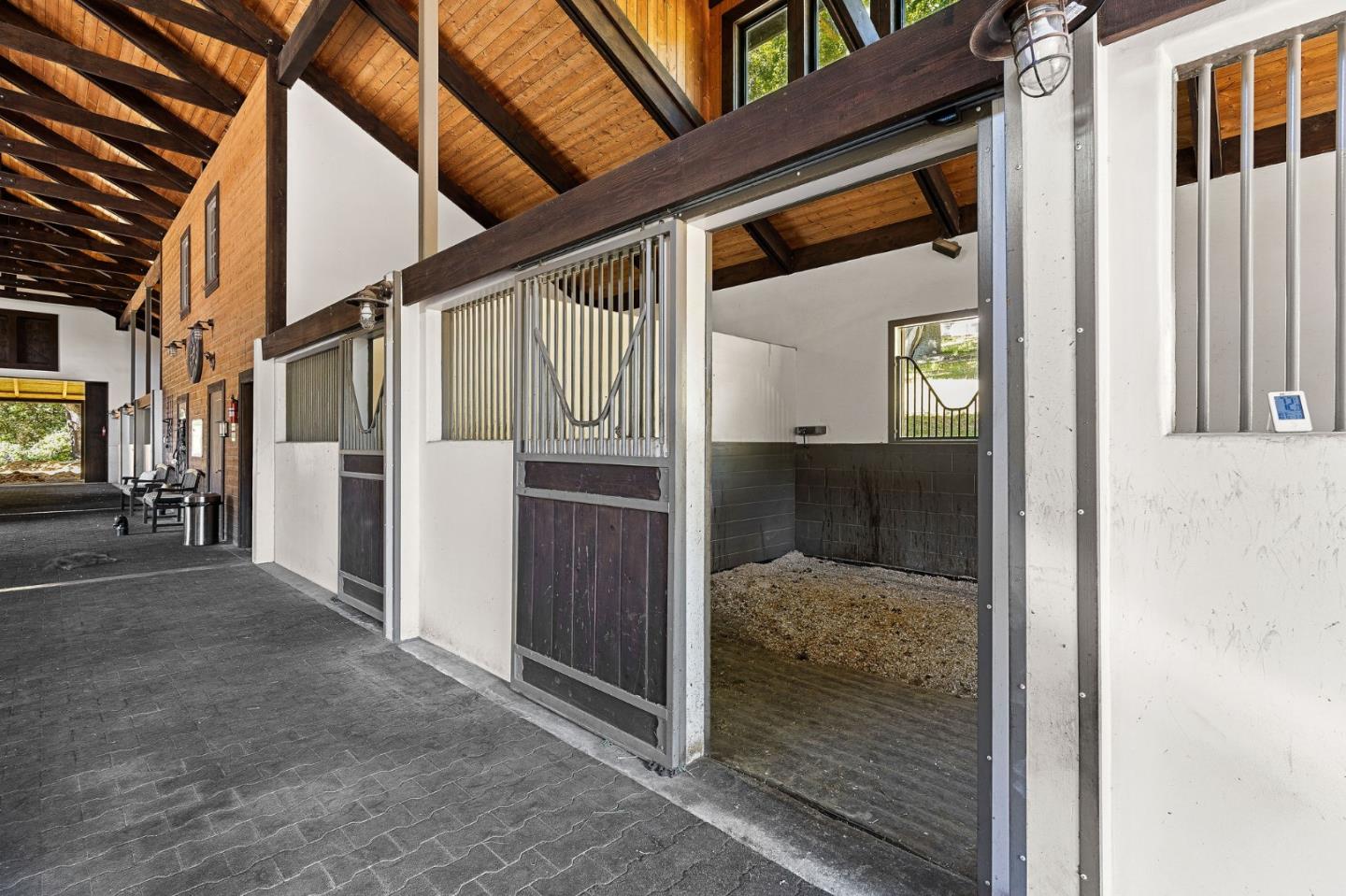 11627 Hidden Hills Road Carmel Valley, CA 93924 - Photo 13 of 62 a view of a hallway with a glass door and shower