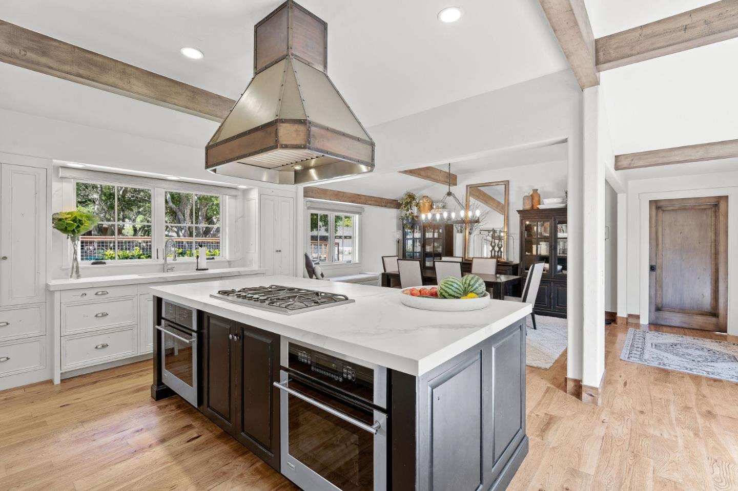 11627 Hidden Hills Road Carmel Valley, CA 93924 - Photo 20 of 62 a kitchen that has a stove and a table