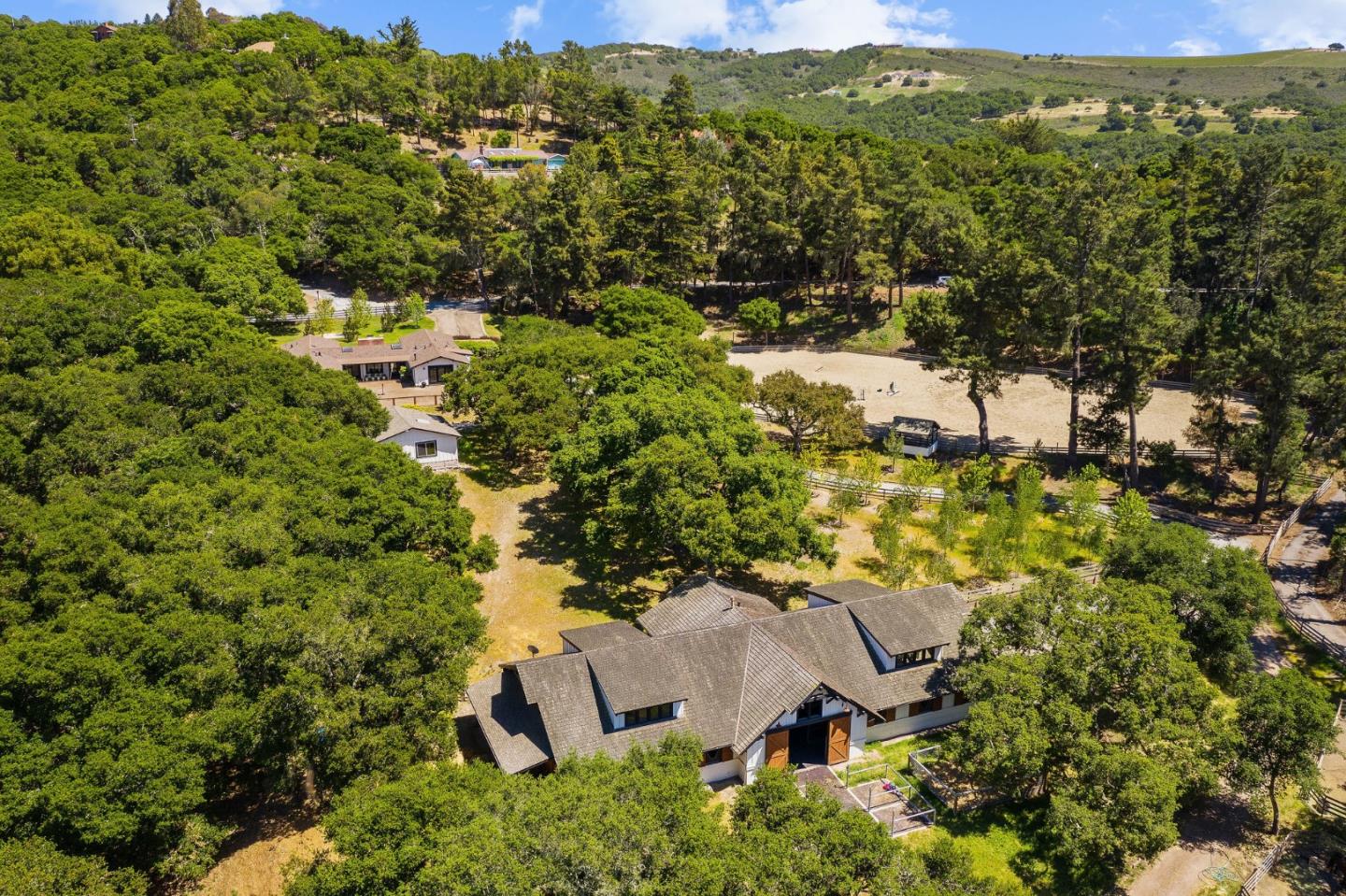 11627 Hidden Hills Road Carmel Valley, CA 93924 - Photo 2 of 62 an aerial view of residential houses with outdoor space and trees