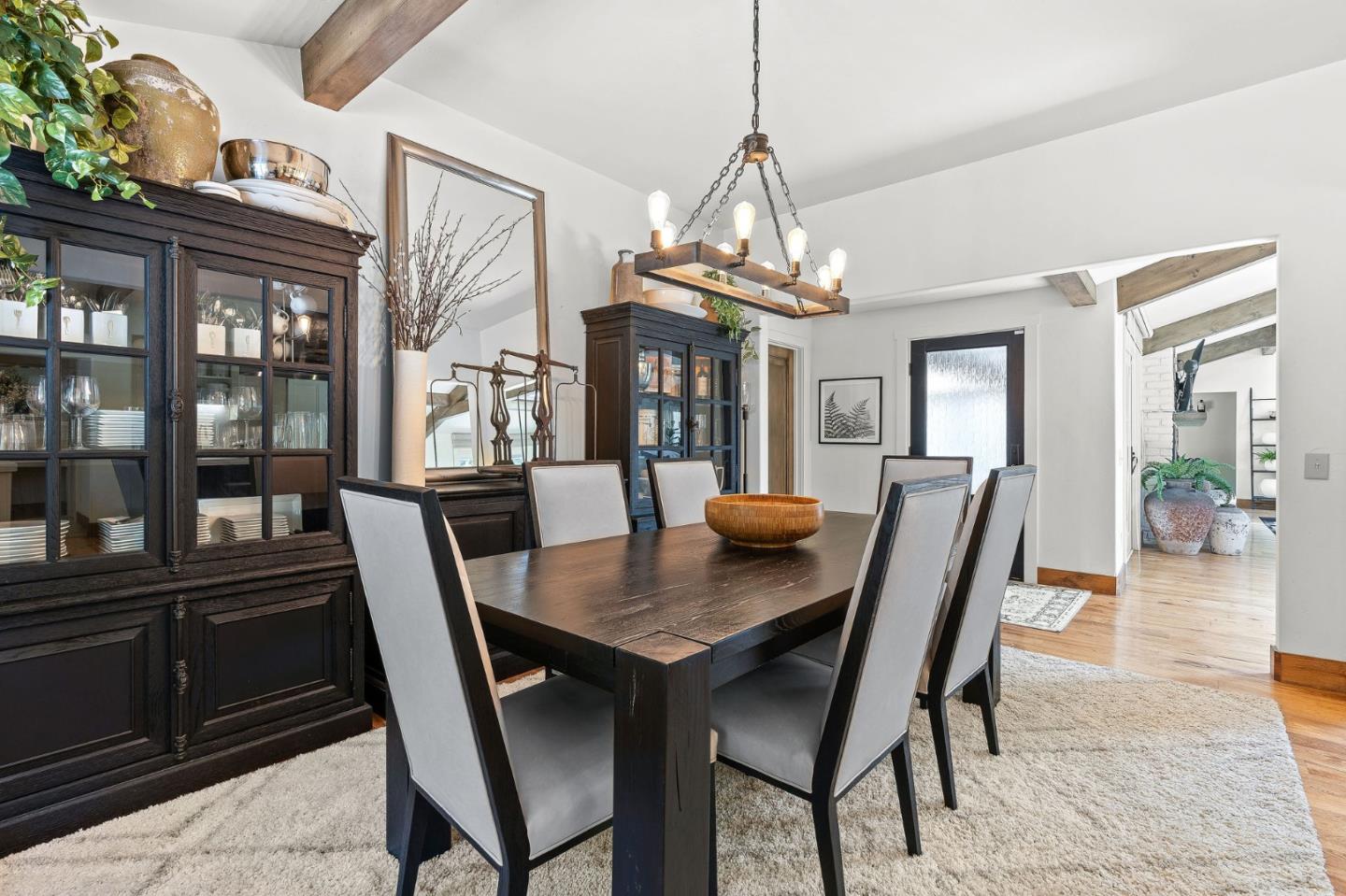 11627 Hidden Hills Road Carmel Valley, CA 93924 - Photo 22 of 62 a view of a dining room with furniture window and wooden floor