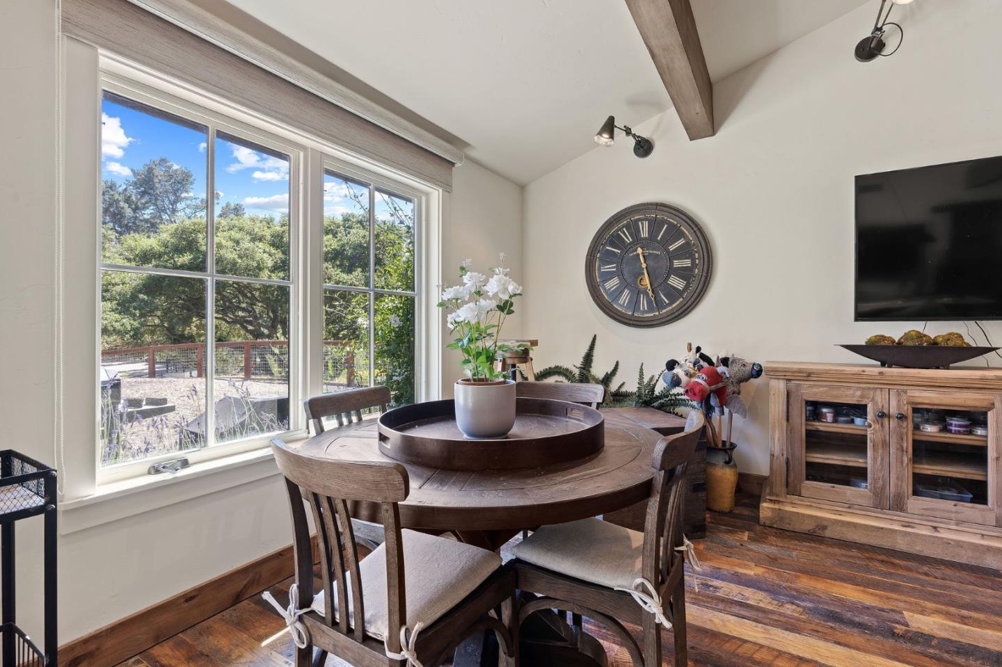 11627 Hidden Hills Road Carmel Valley, CA 93924 - Photo 37 of 62 a view of a dining room with furniture window and wooden floor