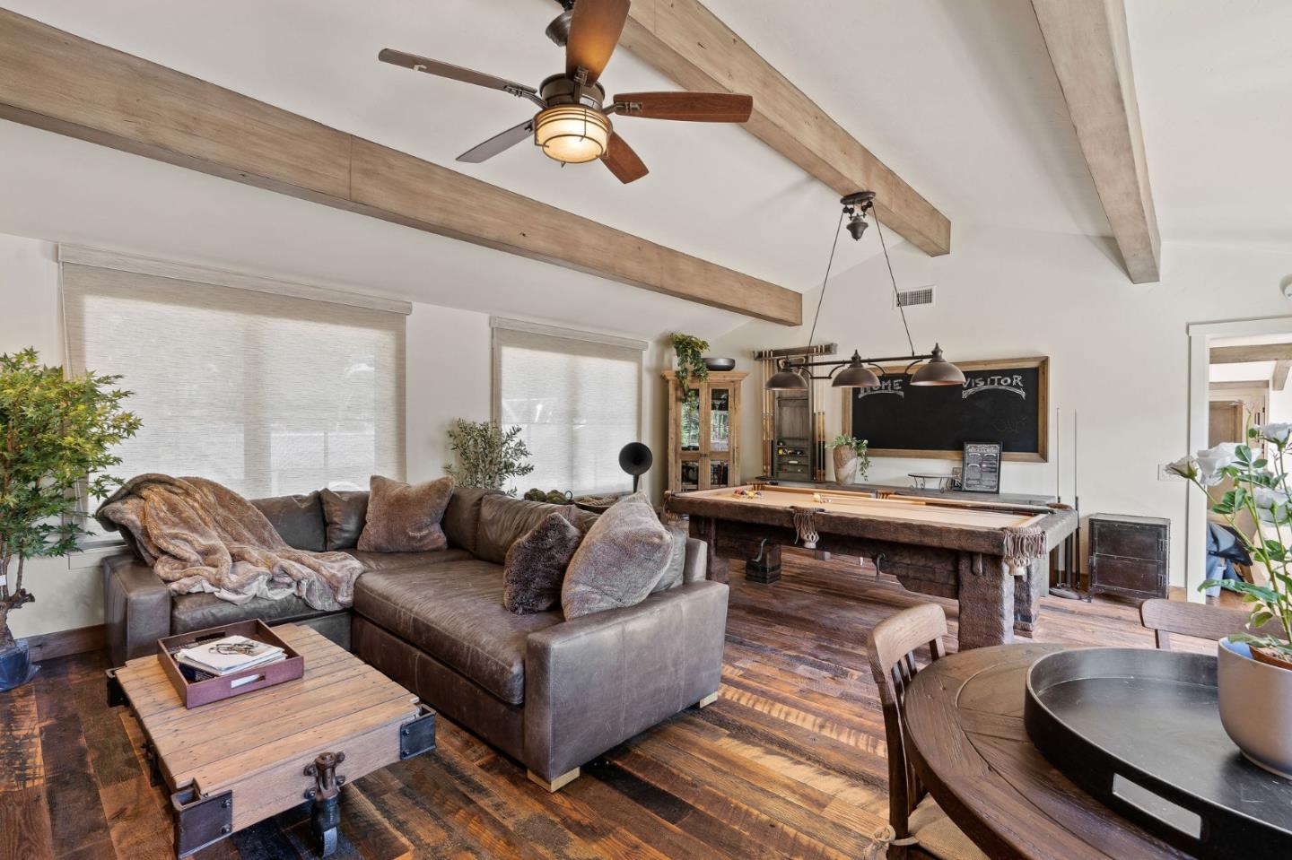 11627 Hidden Hills Road Carmel Valley, CA 93924 - Photo 38 of 62 a living room with furniture and a wooden floor