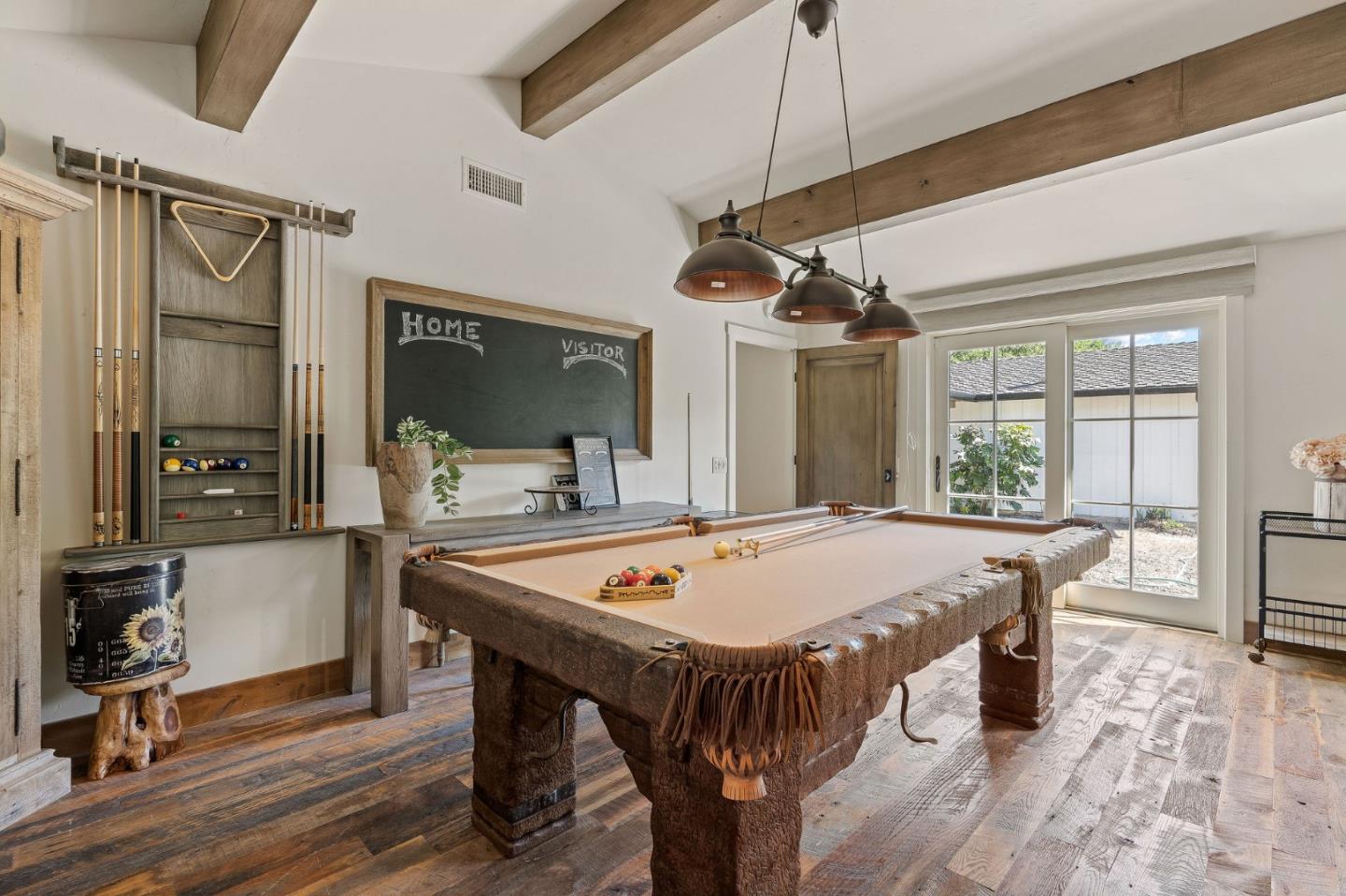 11627 Hidden Hills Road Carmel Valley, CA 93924 - Photo 41 of 62 a dining hall with stainless steel appliances granite countertop a table chairs and a refrigerator