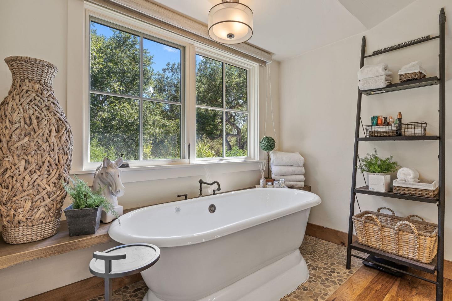 11627 Hidden Hills Road Carmel Valley, CA 93924 - Photo 46 of 62 a bathroom with a sink and a window