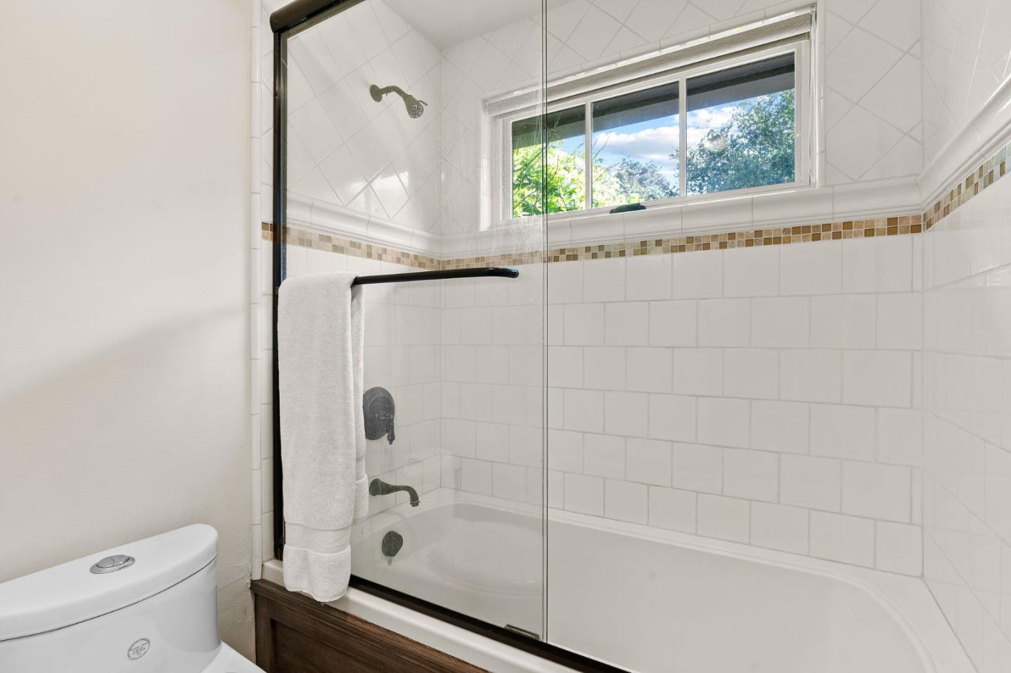 11627 Hidden Hills Road Carmel Valley, CA 93924 - Photo 50 of 62 a bathroom with a granite countertop bathtub shower and toilet