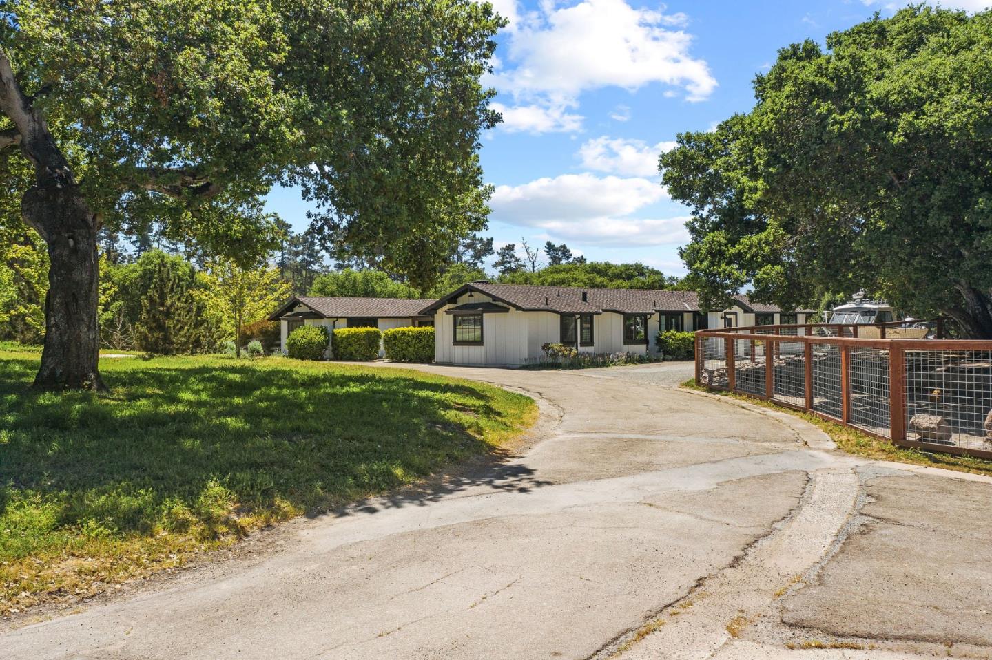 11627 Hidden Hills Road Carmel Valley, CA 93924 - Photo 5 of 62 a front view of a house with a garden