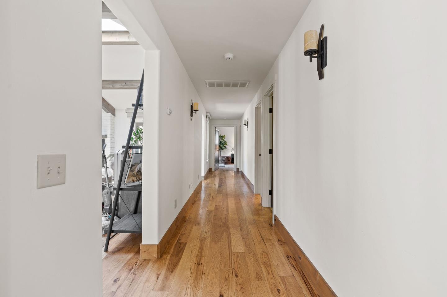 11627 Hidden Hills Road Carmel Valley, CA 93924 - Photo 51 of 62 a view of a hallway with wooden floor and entryway