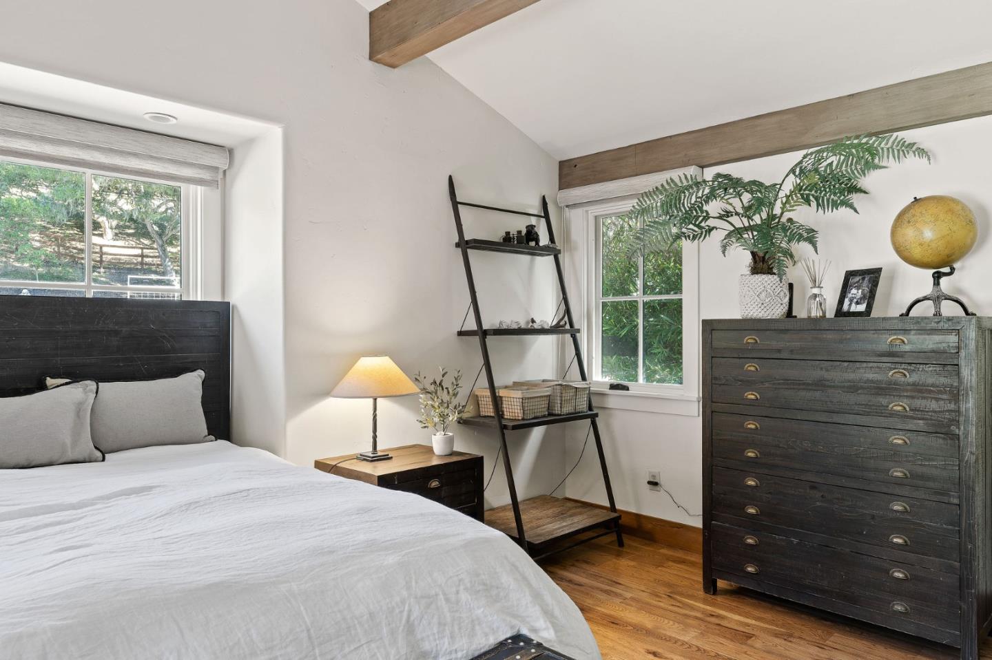 11627 Hidden Hills Road Carmel Valley, CA 93924 - Photo 53 of 62 a bedroom with a bed window and a potted plant