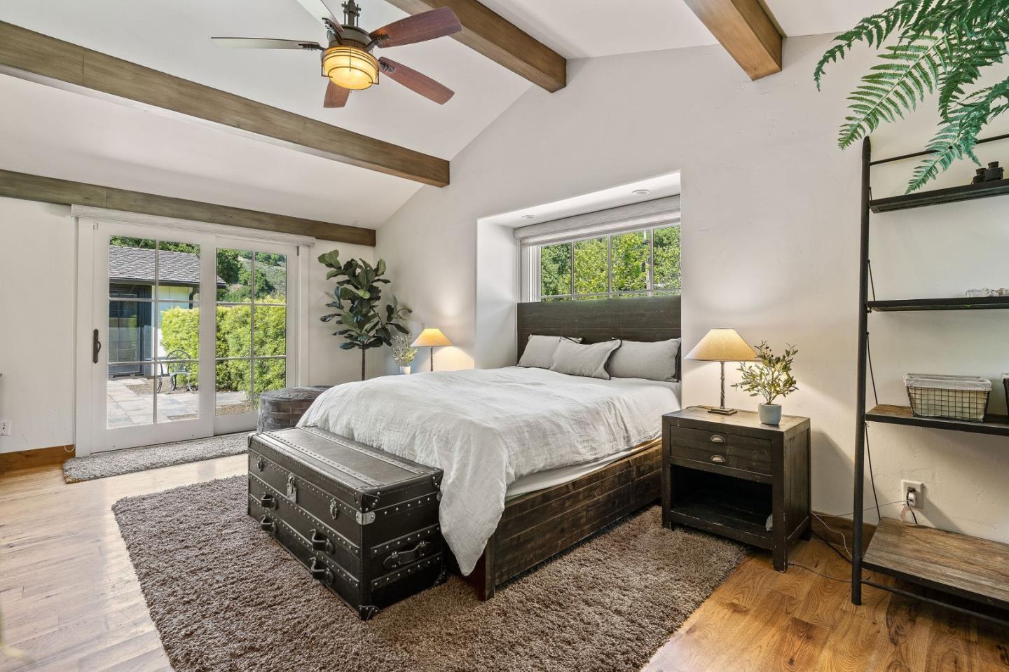11627 Hidden Hills Road Carmel Valley, CA 93924 - Photo 54 of 62 a spacious bedroom with a bed and window