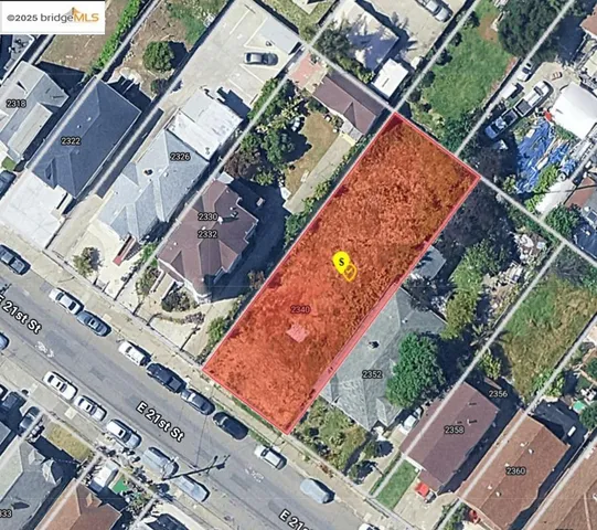 an aerial view of a tennis ground and a cars park side of the road