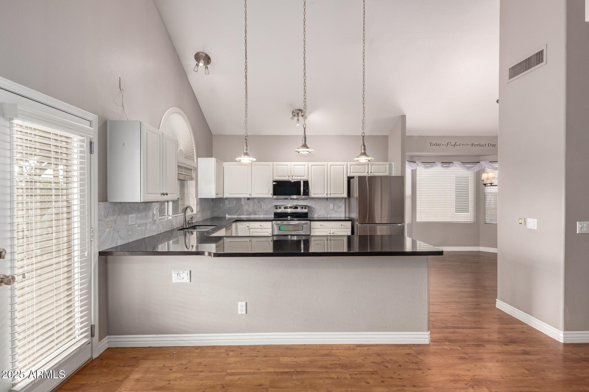 1284 North Conner Avenue Gilbert, AZ 85209 - Photo 12 of 45 a view of kitchen with stainless steel appliances granite countertop a sink a stove and a refrigerator