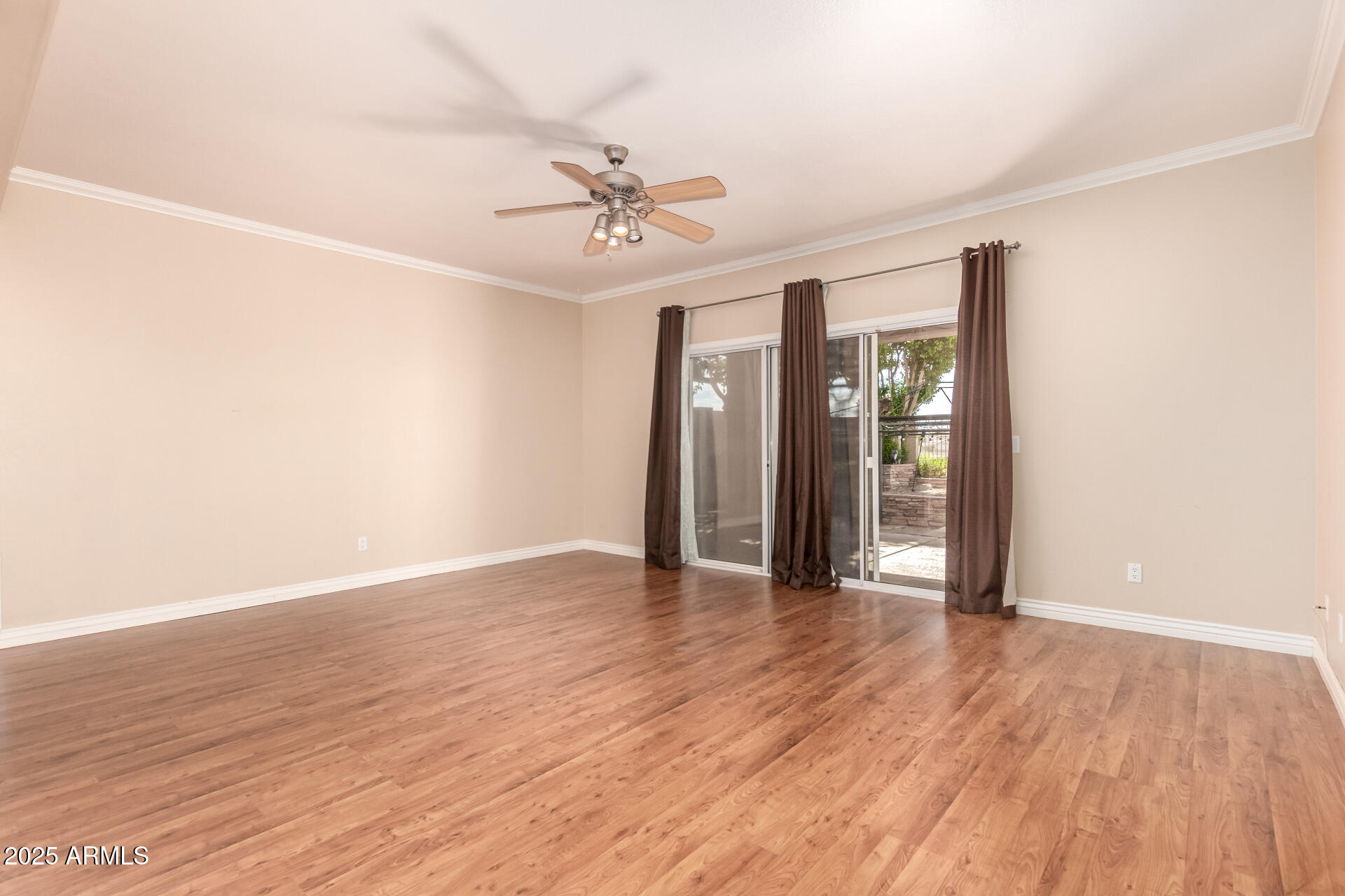 1284 North Conner Avenue Gilbert, AZ 85209 - Photo 18 of 45 a view of an empty room with wooden floor