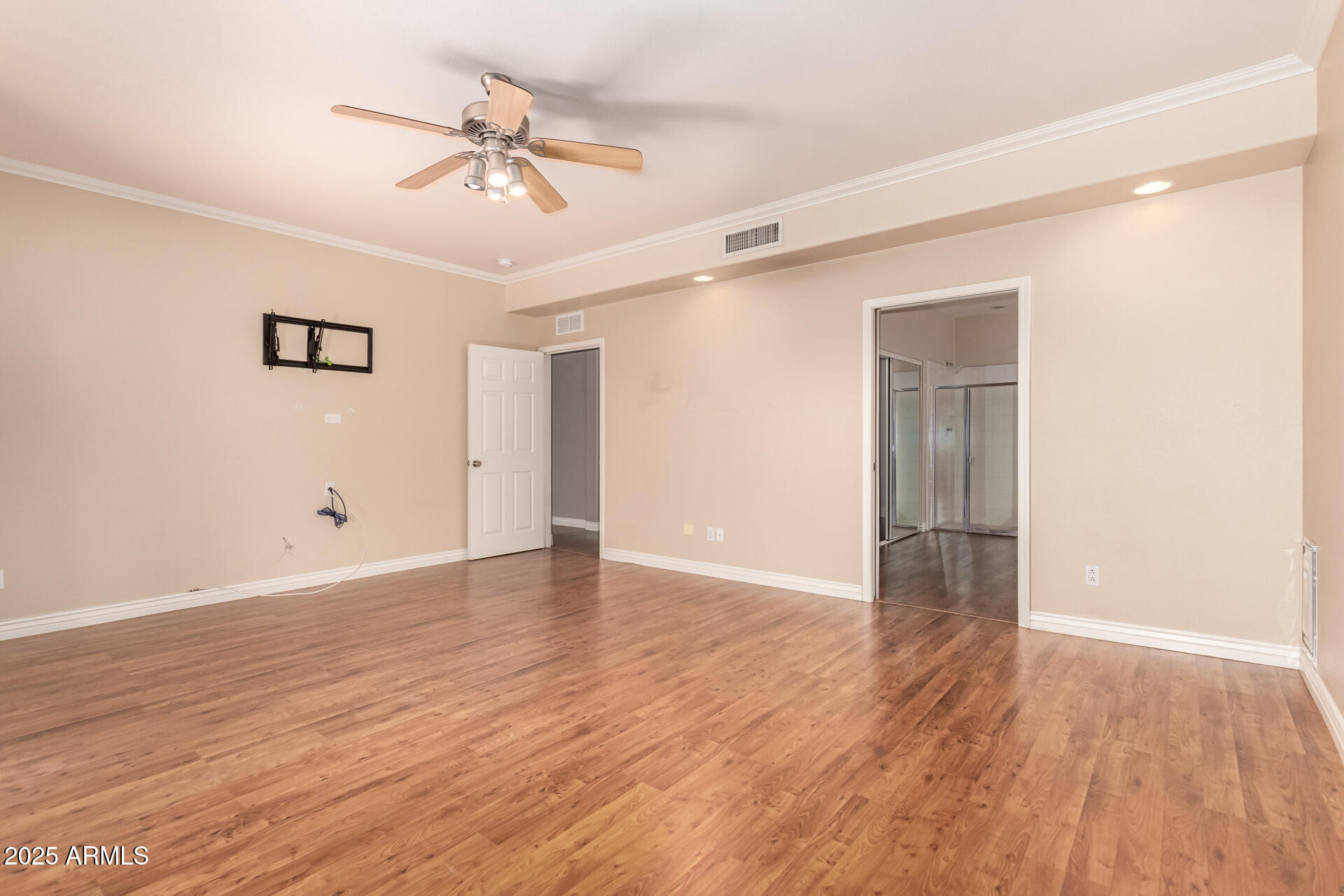 1284 North Conner Avenue Gilbert, AZ 85209 - Photo 19 of 45 a view of an empty room with wooden floor