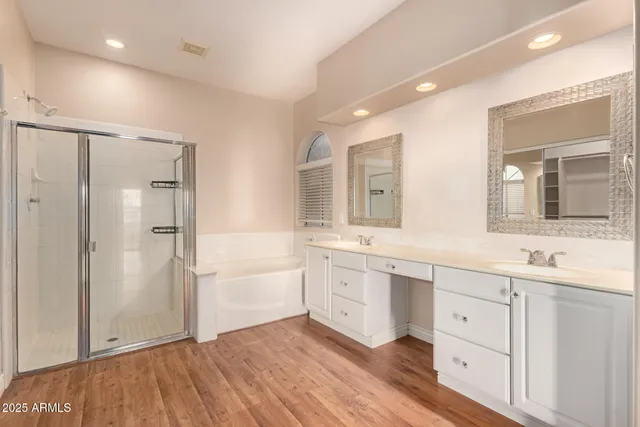 a bathroom with a bathtub and a sink