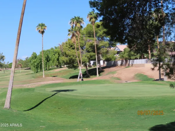 a view of a terrace with a table and a dishwasher