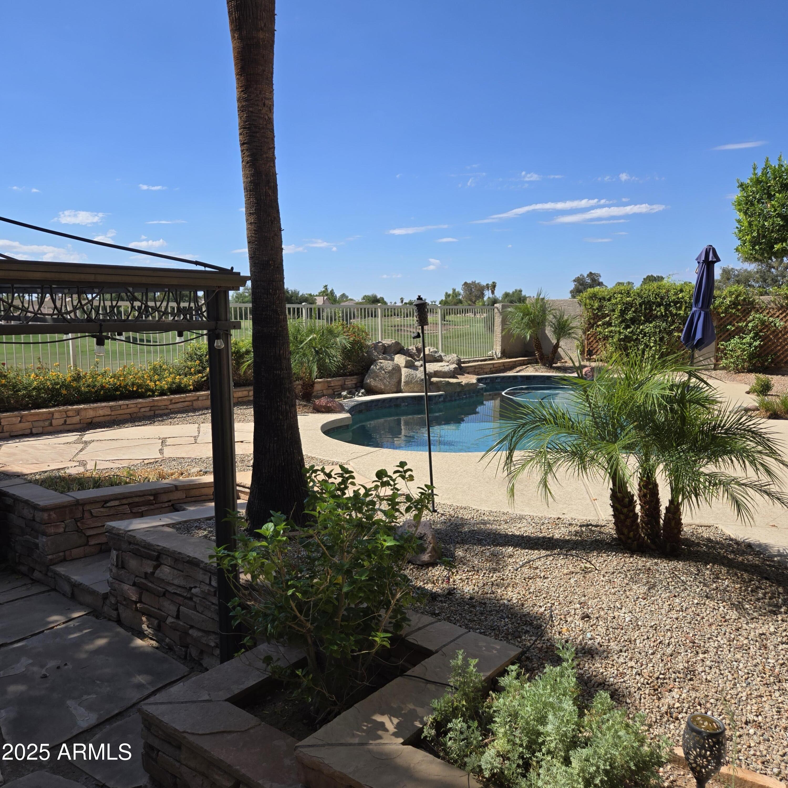 1284 North Conner Avenue Gilbert, AZ 85209 - Photo 41 of 45 a view of a street with a tree