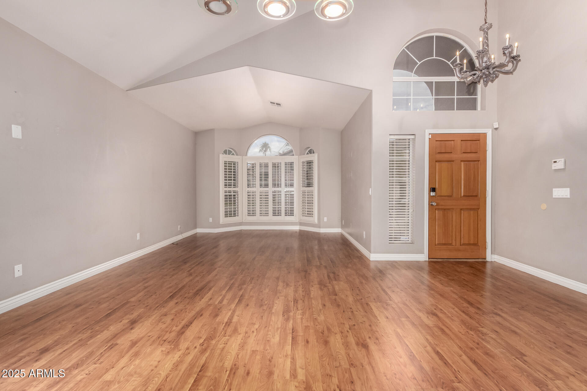 1284 North Conner Avenue Gilbert, AZ 85209 - Photo 6 of 45 wooden floor in an empty room with a window