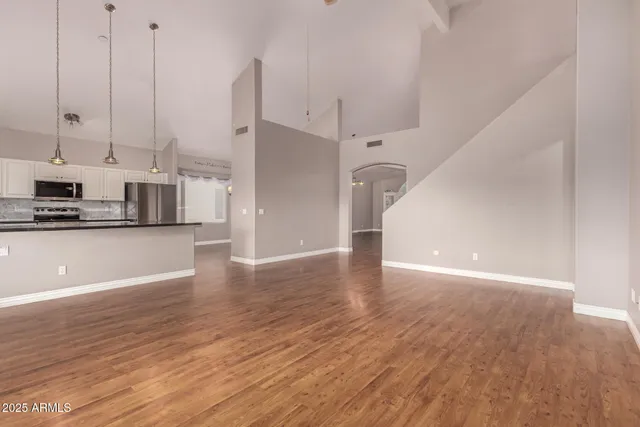 a view of a kitchen with wooden floor