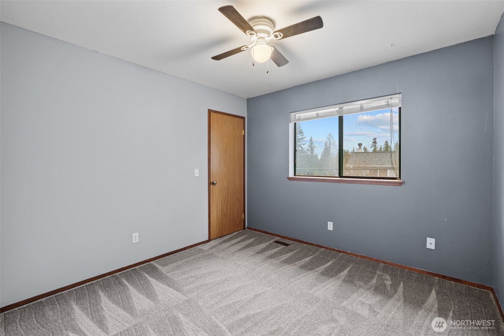 21641 Southeast 266th Street Maple Valley, WA 98038 - Photo 13 of 40 a view of an empty room with a window