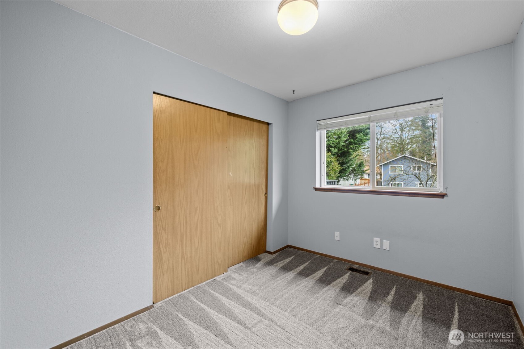 21641 Southeast 266th Street Maple Valley, WA 98038 - Photo 14 of 40 a view of a room that has a bed in it