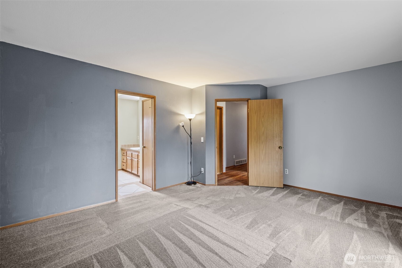 21641 Southeast 266th Street Maple Valley, WA 98038 - Photo 16 of 40 a view of an empty room with closet and entryway