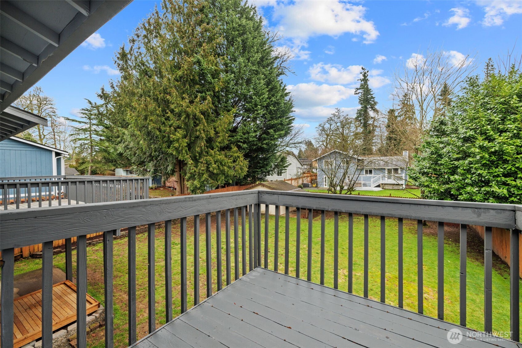 21641 Southeast 266th Street Maple Valley, WA 98038 - Photo 19 of 40 a balcony with trees in front of it